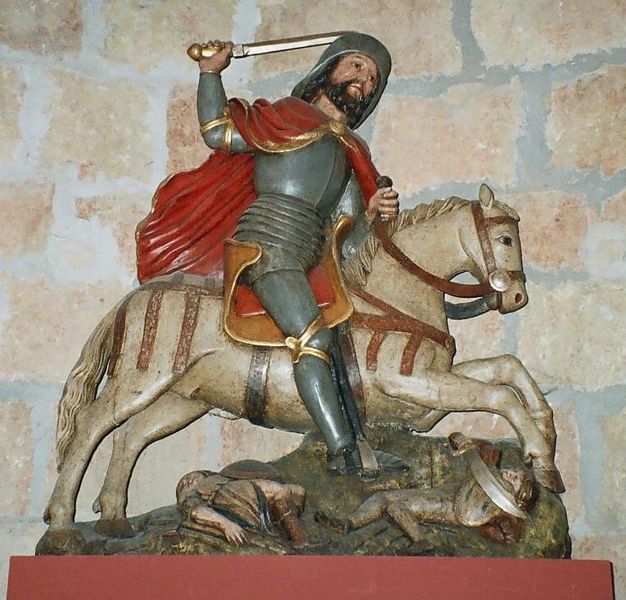 statuette of Saint James the Moor-slayer mounted on horse back above slain Moors